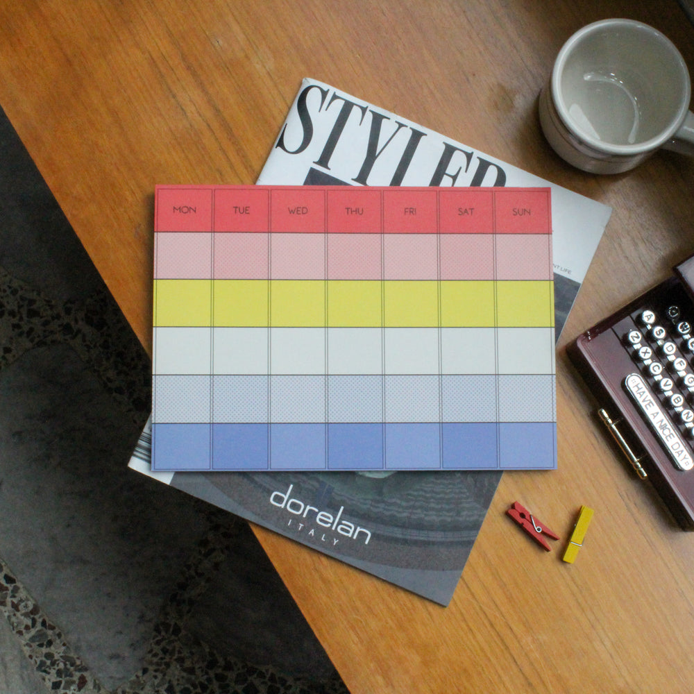 Monthly deskpad with different colors on the table