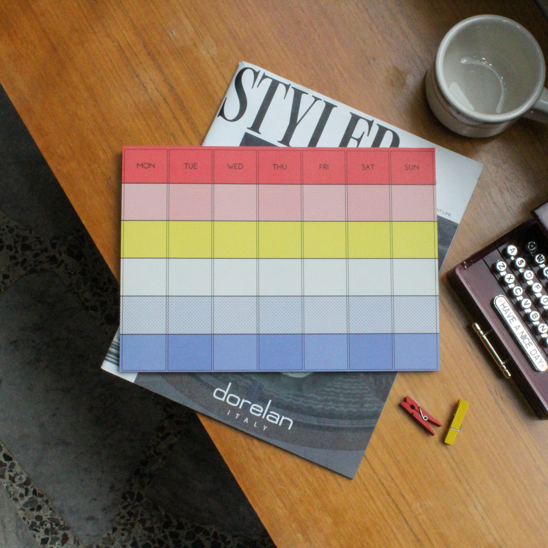 Monthly deskpad with different colors on the table