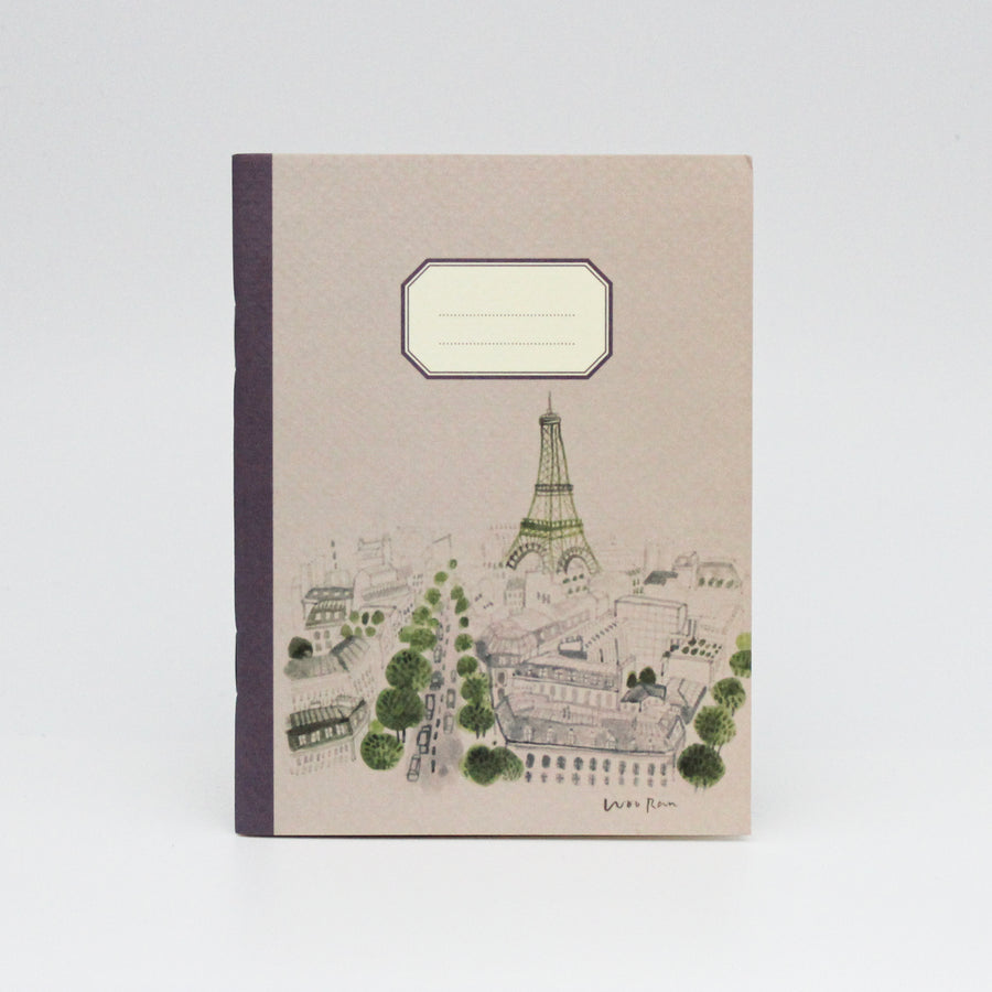 Notebook with Eiffel Tower illustration on a beige cover