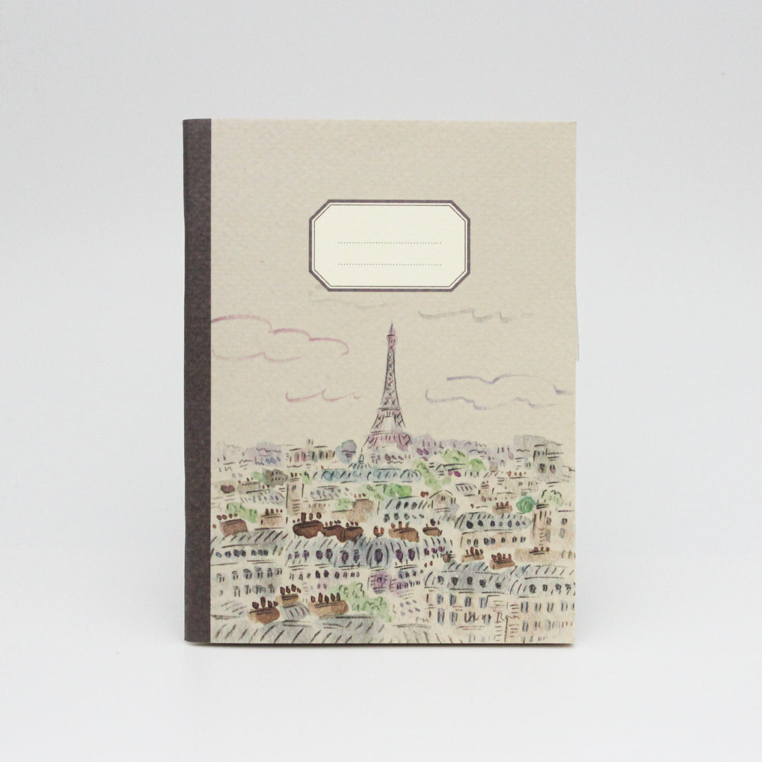 Notebook with Eiffel Tower design on a white background