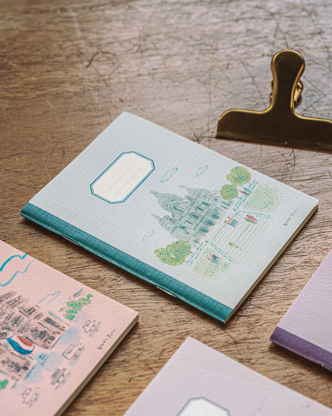 Notebook with a famous landmark design on a wooden surface