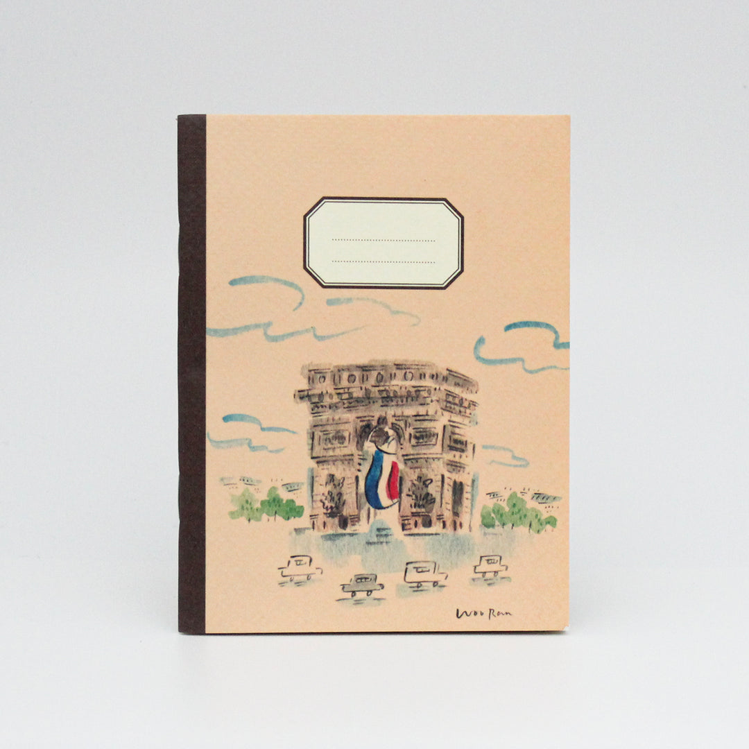 Notebook with a design of a building and people on a beige cover against a white background