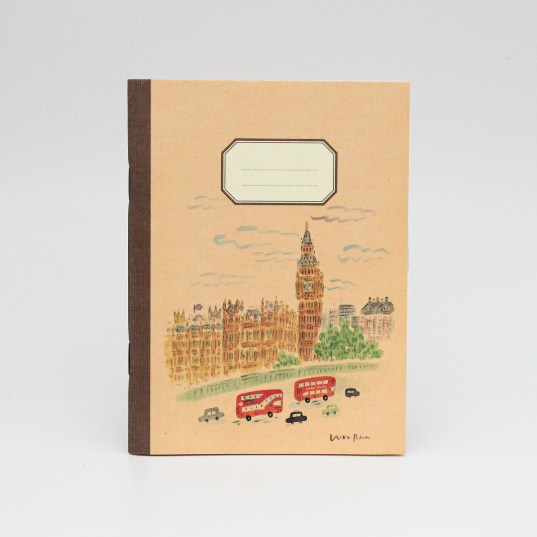 Notebook with a London-themed cover featuring Big Ben and red buses on a beige background.