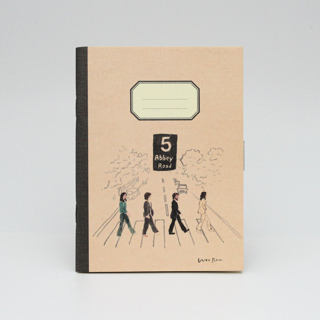 Notebook with '5 Abbey Road' design on a beige background