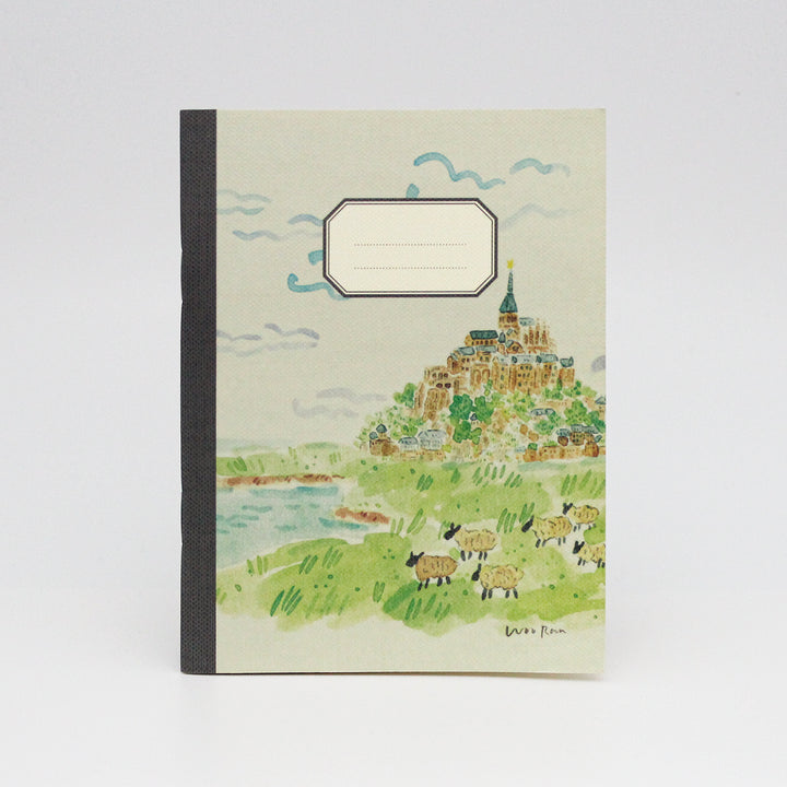 Notebook with a scenic illustration of a village on a hillside.