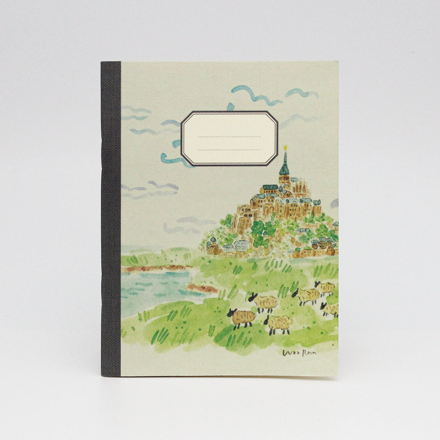 Notebook with a scenic illustration of a village on a hillside.