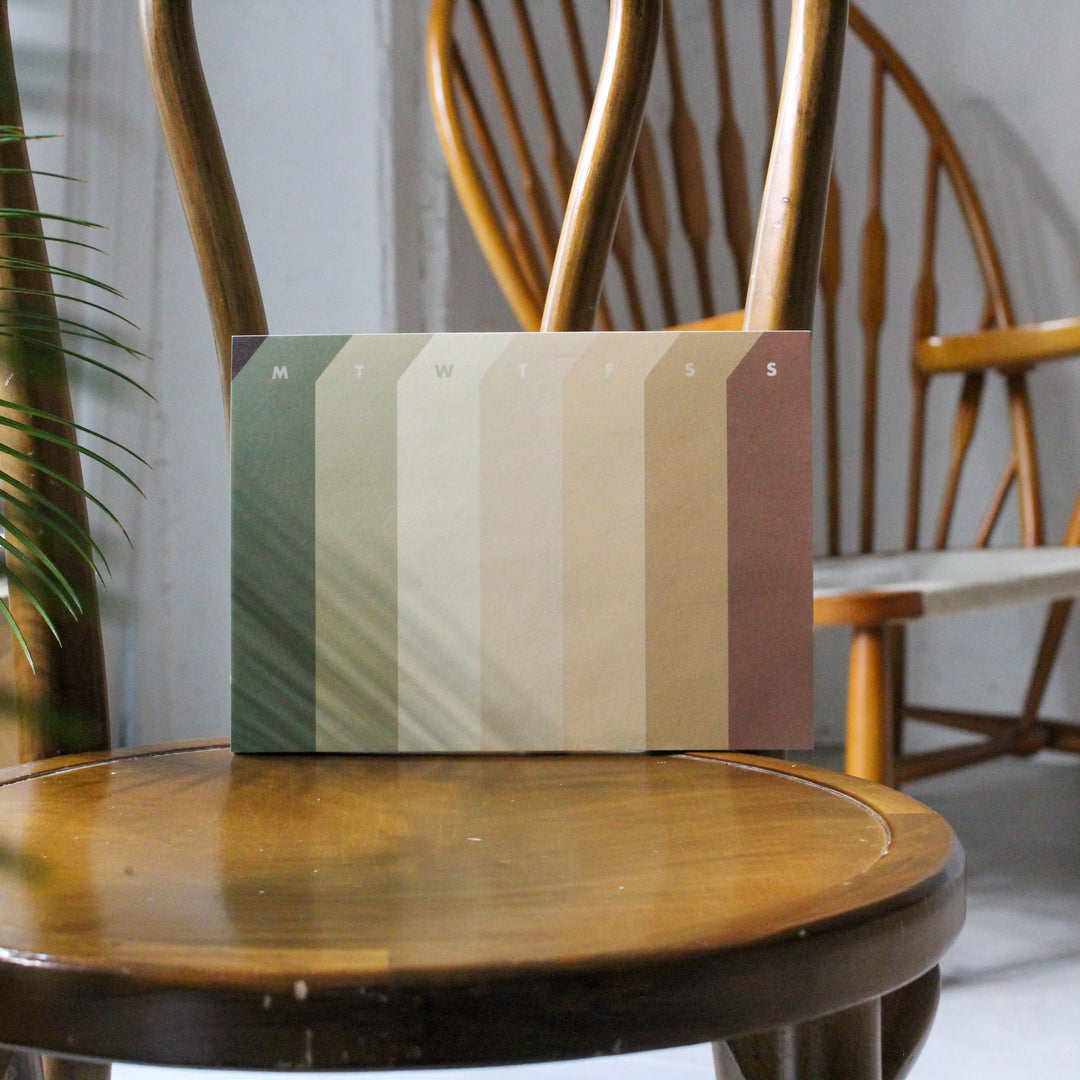 Weekly deskpad on the chair