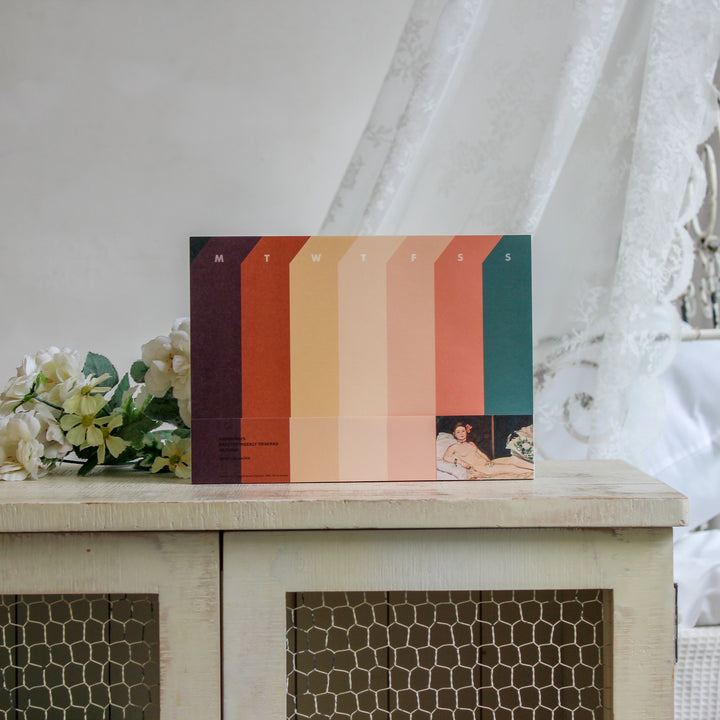 Weekly deskpad with Manet's artwork on the white shelf