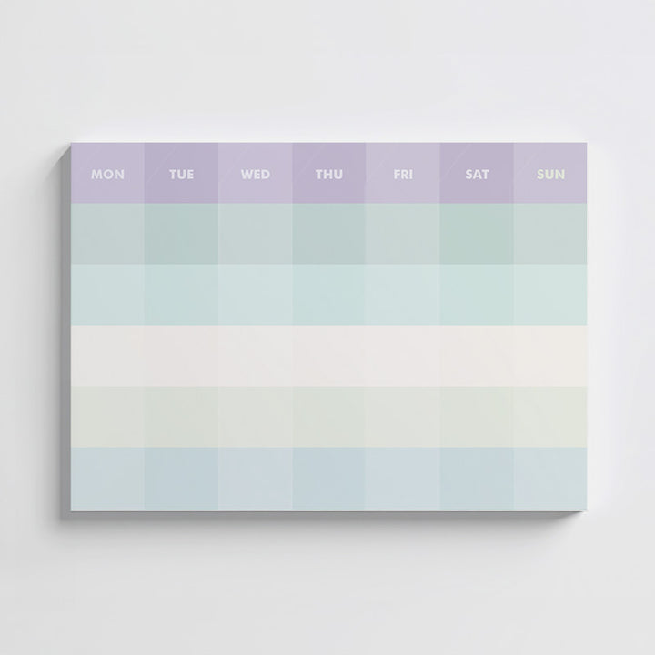 Monthly planner with pastel color gradient and days of the week labels on a white background