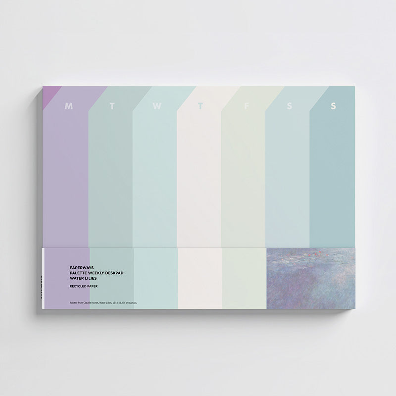 Weekly desk pad with pastel color blocks and days of the week labels on a white background.