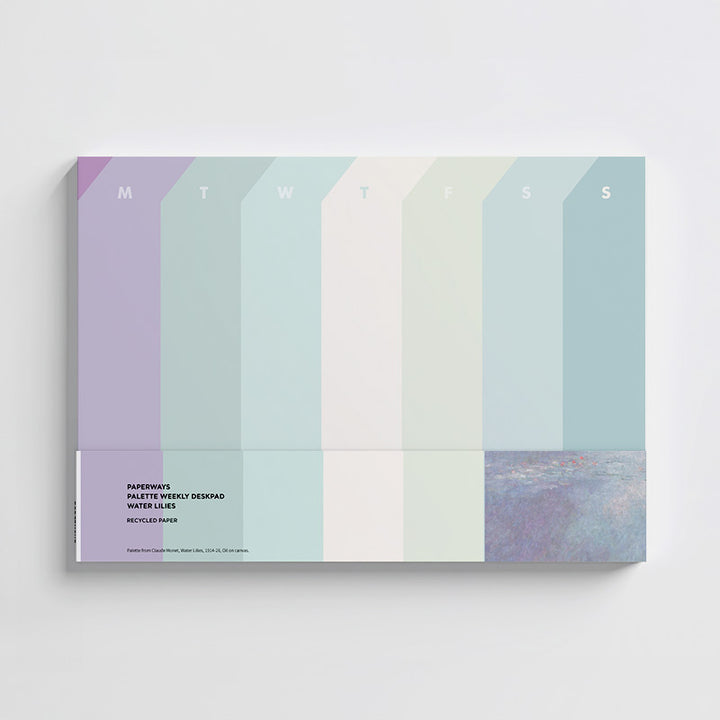 Weekly desk pad with pastel color blocks and days of the week labels on a white background.