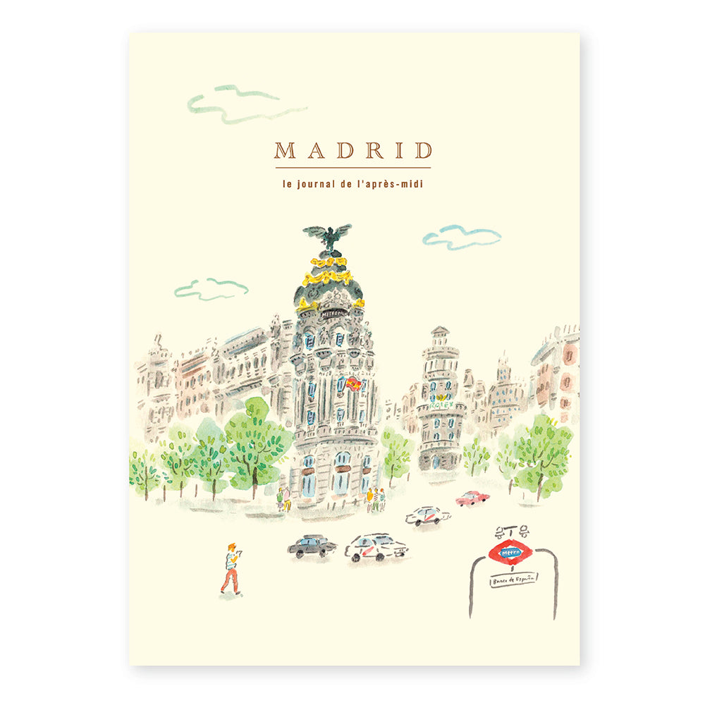 Illustrated cover of a book or magazine titled 'Madrid' with a cityscape design on a light yellow background.